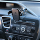 I ran an extra long microUSB cable from my car charger (at the bottom of the photo) under the steering column, up the driver door’s weather seal, and under the windshield, and now I don’t have a cable hanging out in front of my dashboard buttons. This is the best reason to buy this product.